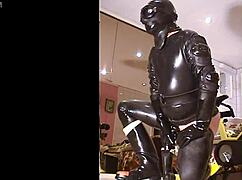 Roxina2003 in crazy rubber retro action with intense gay play.