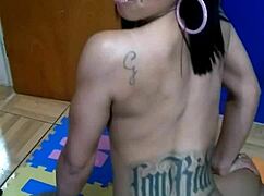 Brunette Woman Sits On The Console For The First Time, Topless With Tattoos