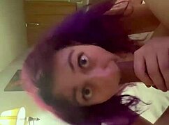 feeling the intense passion as purple haired girl sucks his cock deeply and eagerly