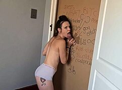 Why is this gloryhole slut sucking and jerking to get through the doorway?