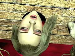 A beautiful girl in wooden handcuffs has a big ork cock in her vagina