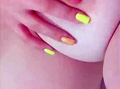 Young maid flaunts big tits for boss in close-up video.