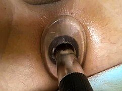 close up view of tight anal tunnel stretched by vibrator and dildo