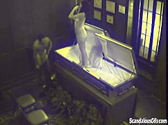 Watch This Couple Get Caught Fucking Hardcore In A Coffin!