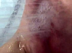 I slip off my nylon stockings and step into the shower for a footjob.