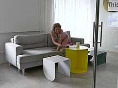 Horny blondie flips through fashion magazines casually