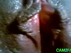 i watch this ebony girl masturbate on webcam, her black skin glowing under the lights, fingers teasing her wet pussy slowly