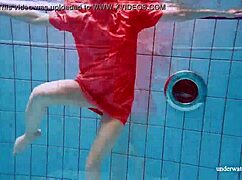 I watch Avenna swim nude, her tight pussy exposed