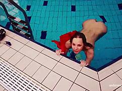 I watch Avenna swim nude, her tight pussy exposed
