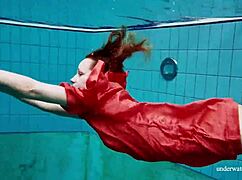 I watch Avenna swim nude, her tight pussy exposed