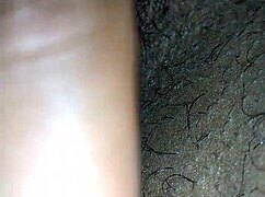 She is MASTURBATING in her private moment.