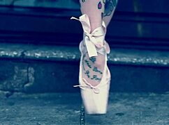 Ballerina strolls in ballet shoes on the street