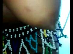 A black girl puts a dildo on the wall to have her ass fucked