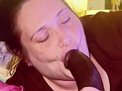 Chubby girl enjoys sucking a big black cock in the bedroom