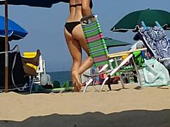 check out this candid video of a little 18+ girl in bikini at the beach