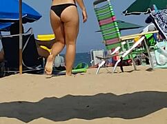check out this candid video of a little 18+ girl in bikini at the beach