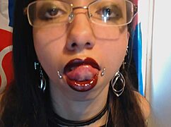 A young goth in dark red lipstick looks sexy