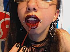 A young goth in dark red lipstick looks sexy