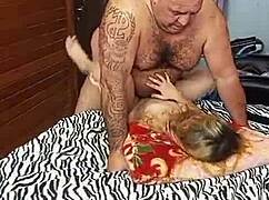 Muscular bodybuilder in lingerie licks hairy belly and armpits of wet young girl