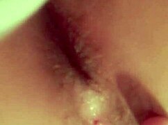 A redhead latina woman performs self-fingering in a private setting.