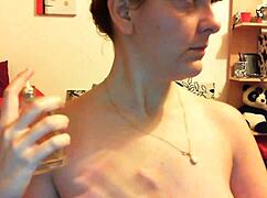 young wife chained in leather, sucking daddy's cock submissively.