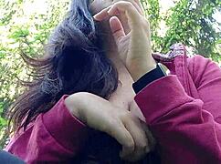 nicoletta smokes in a public garden while flashing her big tits