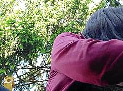 nicoletta smokes in a public garden while flashing her big tits