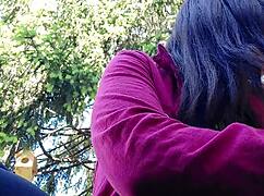 nicoletta smokes in a public garden while flashing her big tits