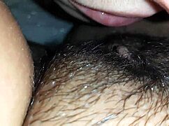 Intense close-up of lesbian couple eating hairy pussy, kissing passionately in homemade POV video