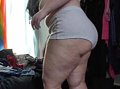 trying on random outfits and teasing the camera with hairy charm