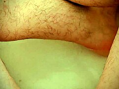Bigdickduder shows off massive cock during steamy bath wank.