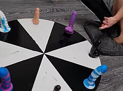 Wheel of dildos she wants to win her orgasm here