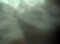 She enjoys a relaxing bath in the bathroom.