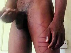 This homemade video shows a big black cock jerking off