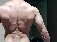 Strong muscular man showing off raw power