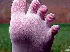 Goddess shows off cute feet in white socks on spring grass