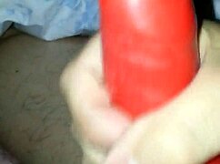 a husband tries on a latex suit with a sheath for his amateur costume.