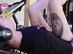 Alternative Girl Stretching At The Gym