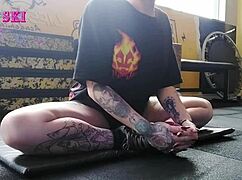 Alternative Girl Stretching At The Gym