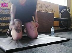 Alternative Girl Stretching At The Gym