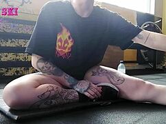 Alternative Girl Stretching At The Gym