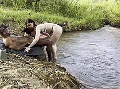 Outdoor Threesome By River With Two Women Sucking And Fucking To Cum Inside