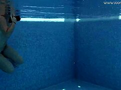 Does Diana Rius touch her hot tits underwater?