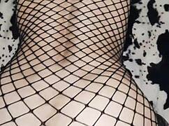 Wife rides in cowgirl position wearing mesh bodysuit.