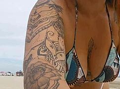 young african girl flashes on usa beach to attract attention