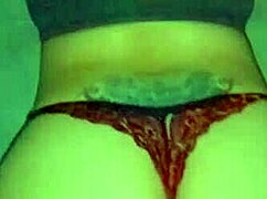 In red thong shaking my ass for horny guys 😏