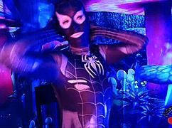 sexy spiderbabe in halloween costume teasing with contrasts