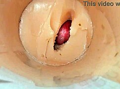 Camera deep inside tight pussy captures huge cum explosion, wet and shaved.