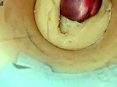 Camera deep inside tight pussy captures huge cum explosion, wet and shaved.