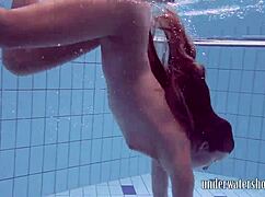 Lucy takes off her bikini in the pool, teasing underwater